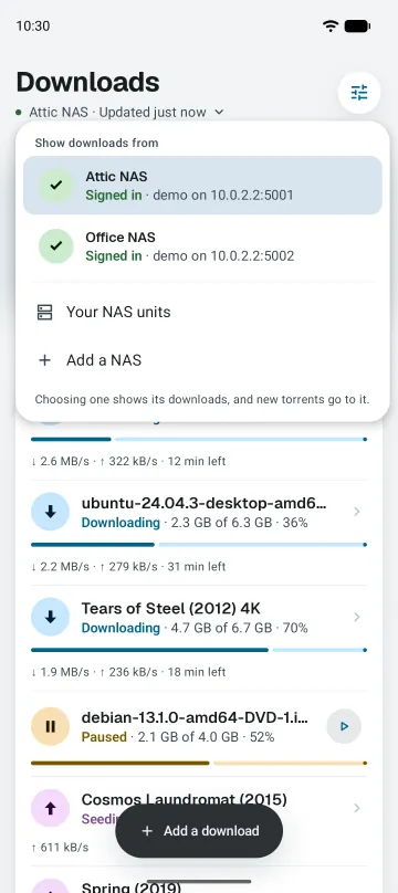 The NAS menu open over Downloads, listing Attic NAS and Office NAS.